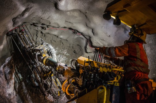 Miner using mining equipment Miner using mining equipment
